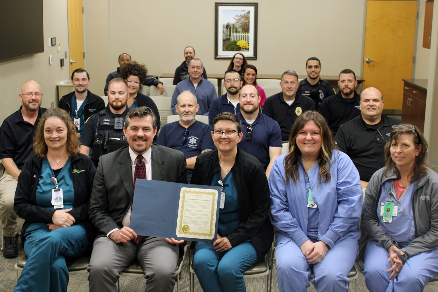 A group of frontline workers pictured with Huntington Mayor Richard Strick