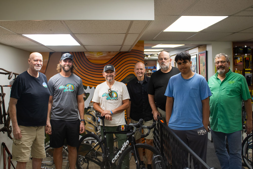 Cyclists meet HARTA President and bike shop staff in Huntington.