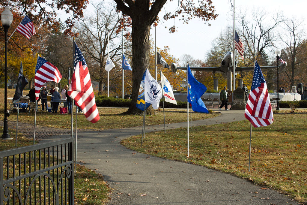 A view of Memorial Park decorated with American flags and banners for Veterans Day in Huntington.