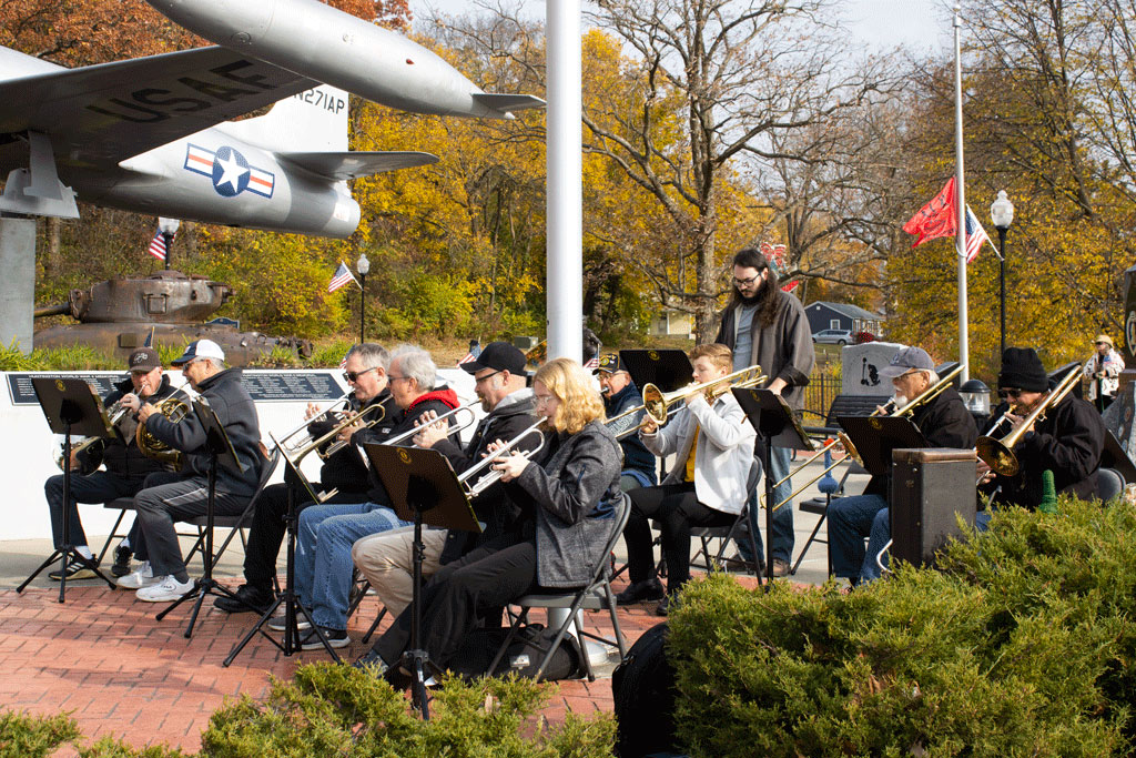 The Erie Band plays patriotic music onstage during the Veterans Day Ceremony.