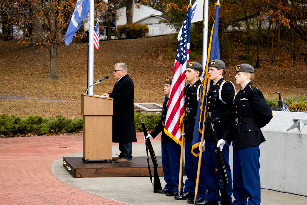 Veterans Service Officer Tim Eckert speaks at a podium during the Veterans Day Ceremony.
