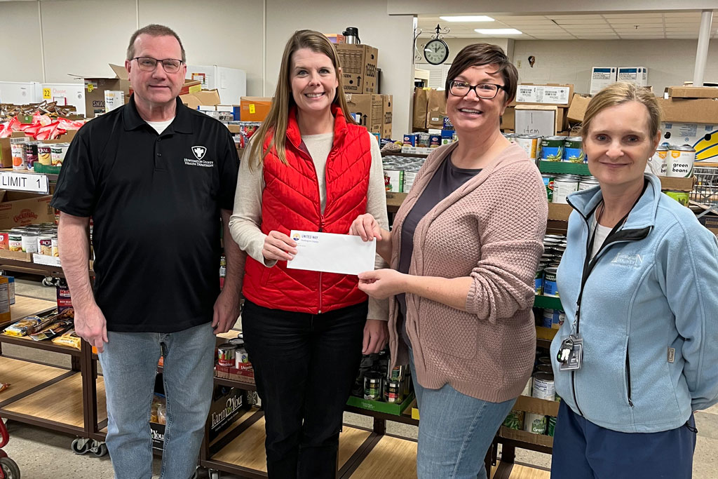 Representatives from the United Way of Huntington County and the local Health Department present a check to Erin Didion of United With Love on December 12, 2025.